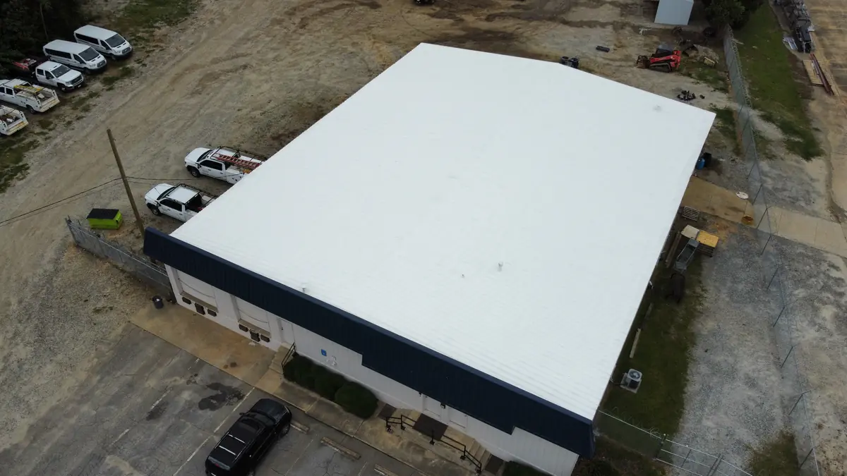 Commercial warehouse roof coating — top-down aerial