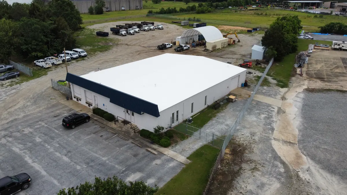 Completed white silicone coating on large commercial warehouse