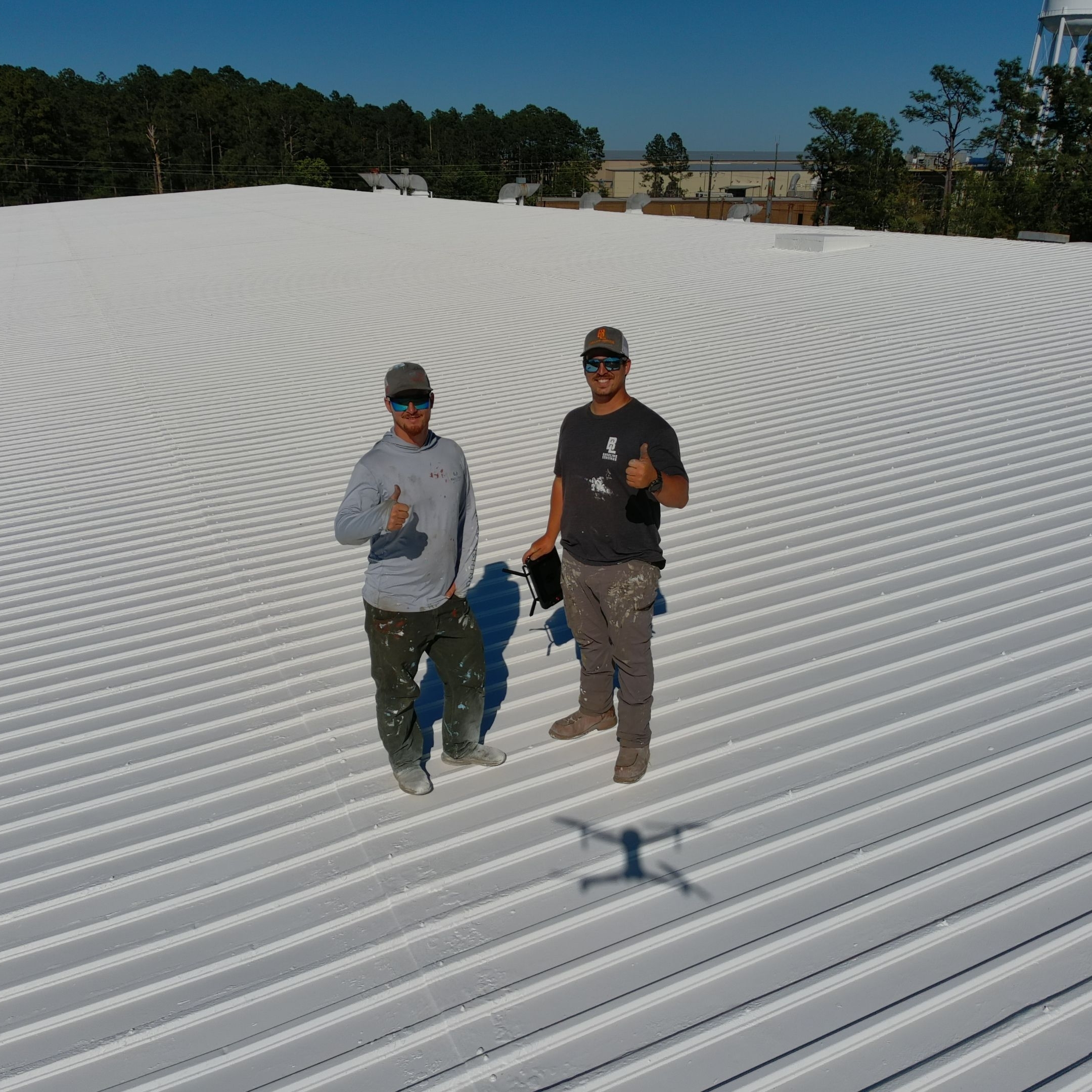 Baseline Coatings crew on completed roof coating project